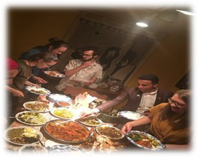 students enjoying a large Tunisian dinner together