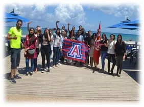 student group photo at beach