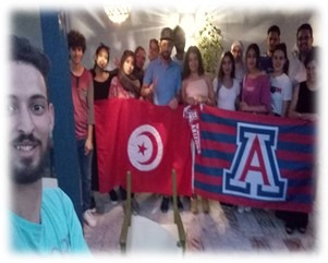 student group photo holding UA and Tunisia flags