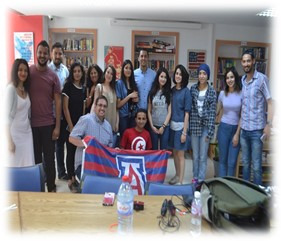 student group photo with UA flag