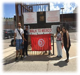 students holding Tunisian flag at US-Mexico Border