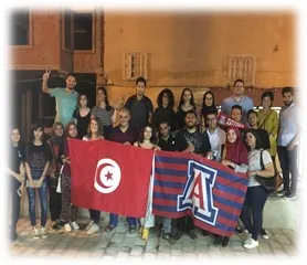 students holding Tunisia and UA flags