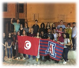 students holding Tunisia and UA flags