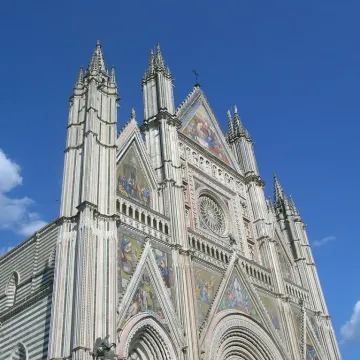 decorative front of building with blue sky above