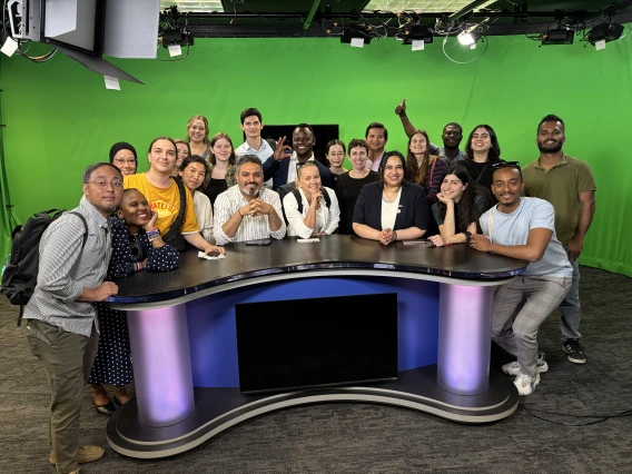 Group of journalists tour broadcast studio